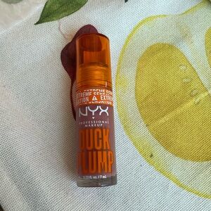 DUCK PLUMP HIGH PIGMENT PLUMPING LIP GLOSS in shade nude swings